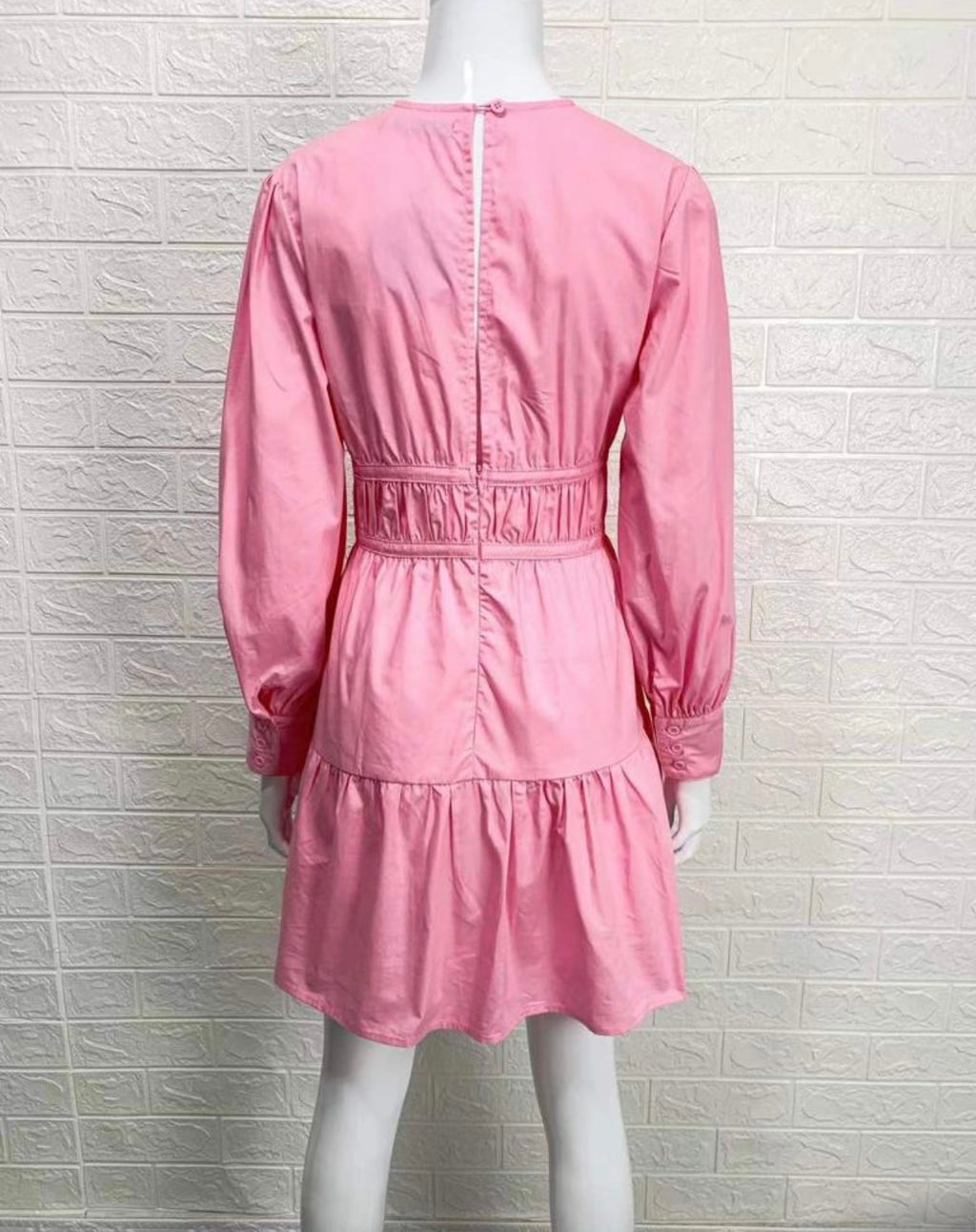 The Pippa dress in pink with long puff sleeves